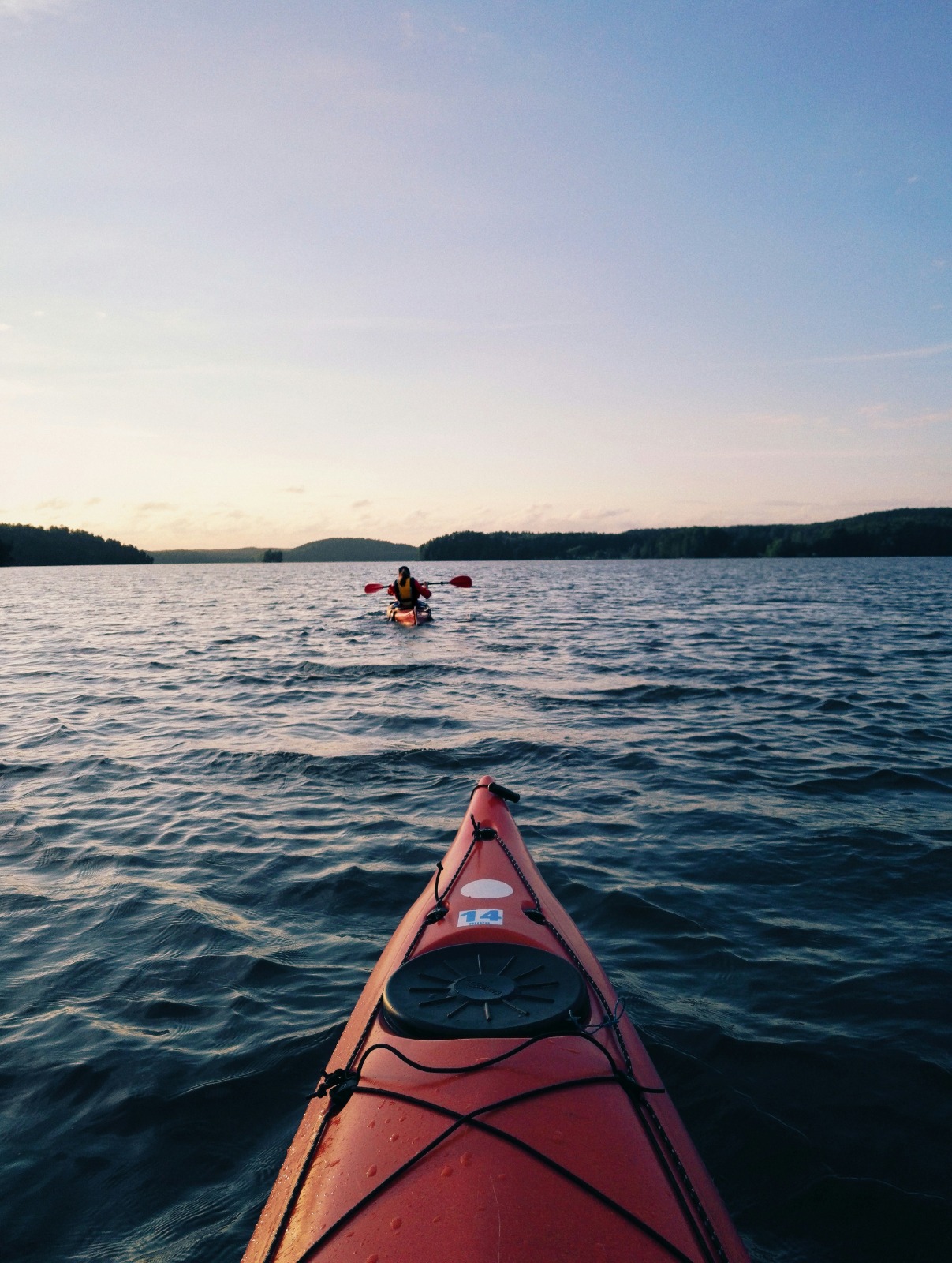 Red kayak on Tomales Bay at dusk
